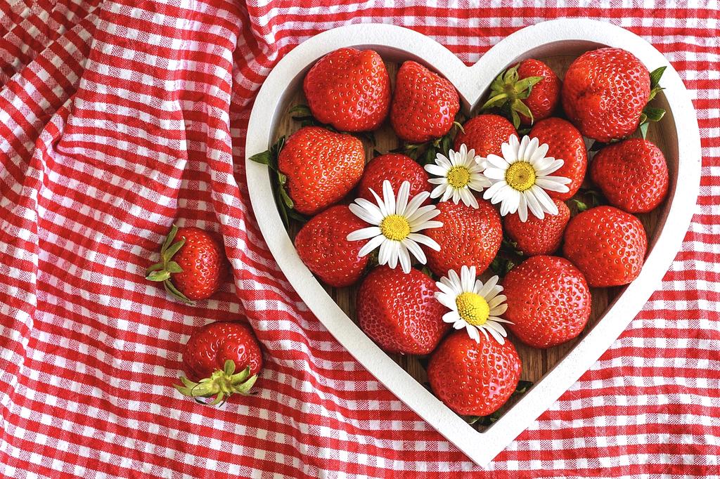 Close-up of fresh fruits, nuts, and seeds for heart health